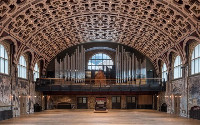 An image of the Grand Hall with the installed organ pipes, console in the middle on the balcony of our Grand Hall