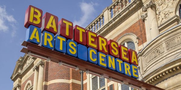 The sign outside our building - yellow letters spell out 'Battersea Arts Centre' on red and blue blocks