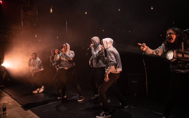 6 beatbox performers face out towards the audience
