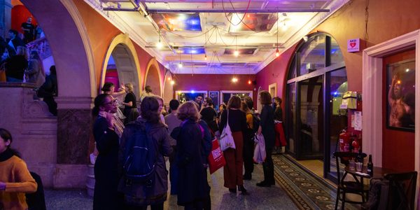 Visitors mingle before the show in the foyer.