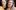 Laura Murphy Asset 2 Laura and Nicole are two white-skinned women with brown hair are facing the camera. One of them is wearing a yellow shirt, the other is in a pale pink adidas sweatshirt.